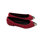 Red tweed flats with silver pointed toes on a white background