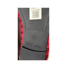 Close-up of a shoe sole with 'OSOS' branding and a QR code on a white background