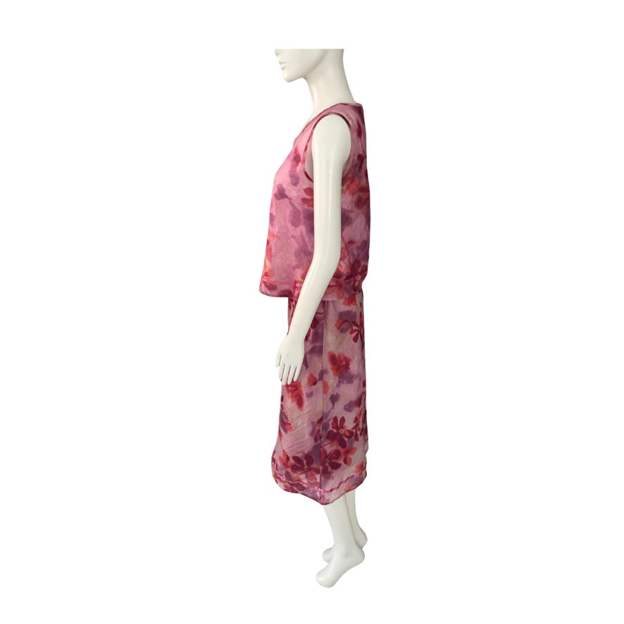 Mannequin wearing a pink floral dress on a white background