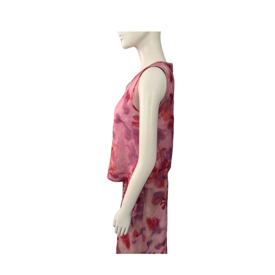 Mannequin wearing a pink floral skirt and top on a white background
