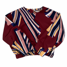 Colorful patterned top on a white background