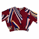 Colorful patterned top on a white background