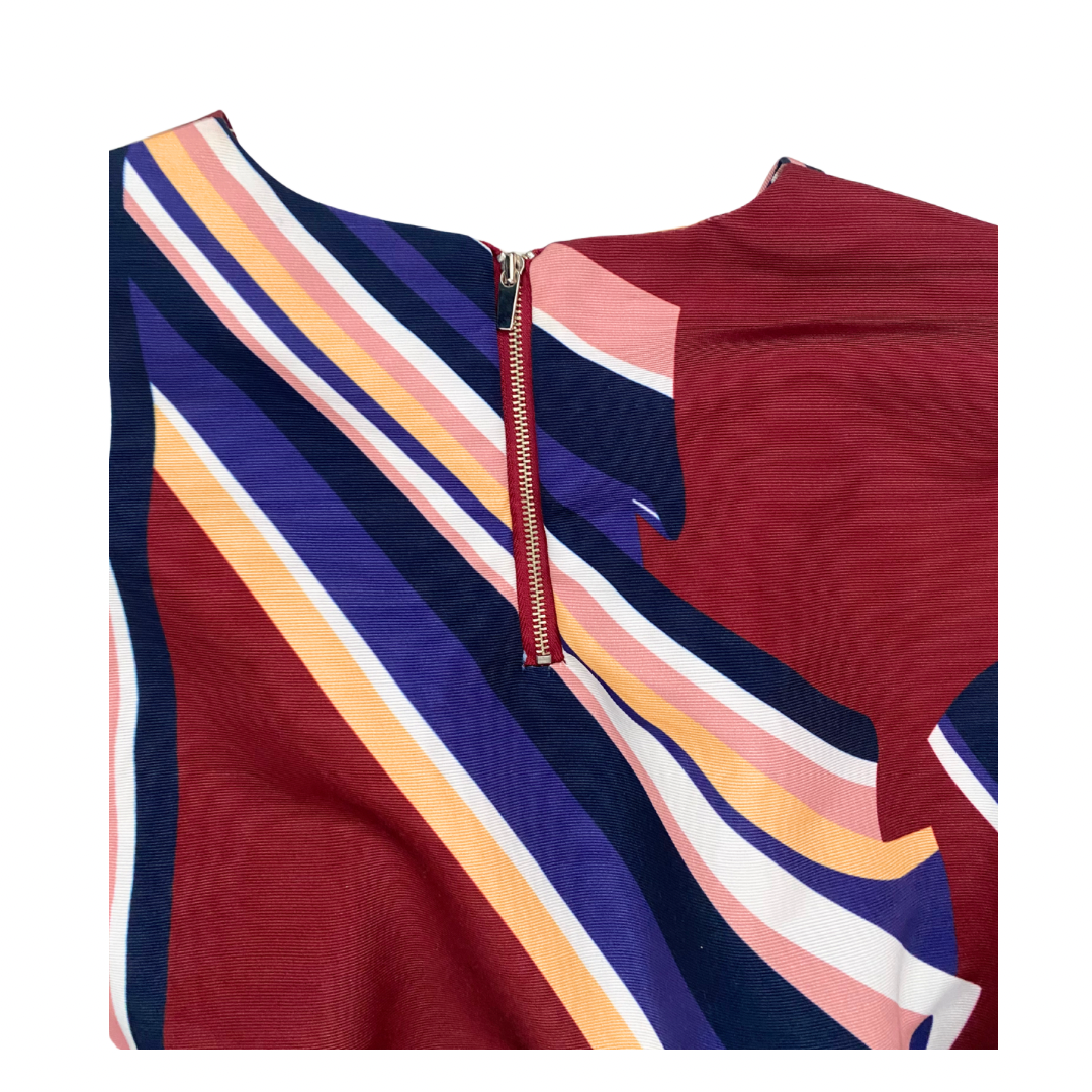 Colorful striped top with a zipper on a white background