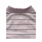 Close-up of a light pink Adidas polo shirt with collar and chest logo.