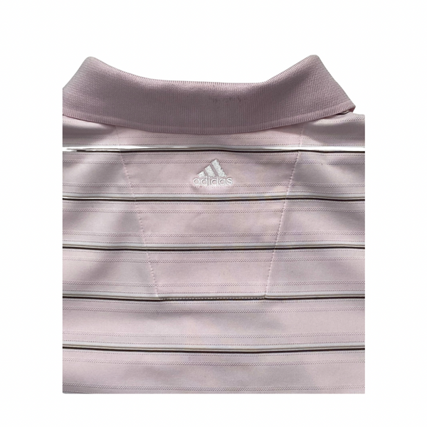 Close-up of a light pink Adidas polo shirt with collar and chest logo.