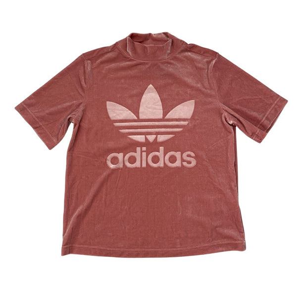 Pink Adidas t-shirt with white logo on a white background