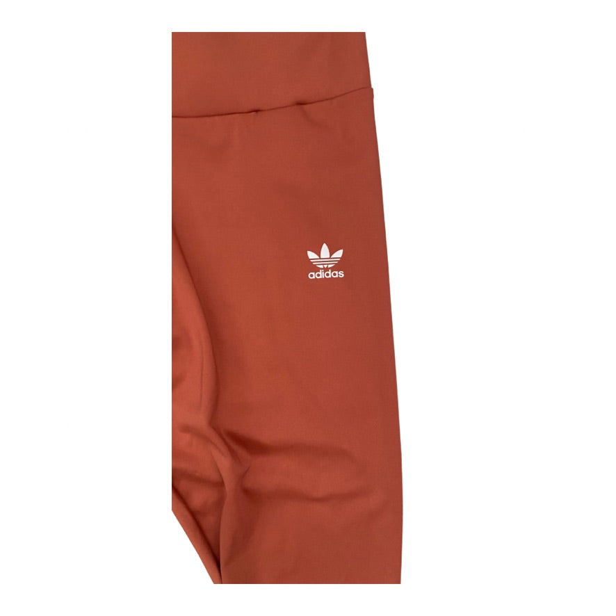 Orange Adidas sweatpants with logo on a white background