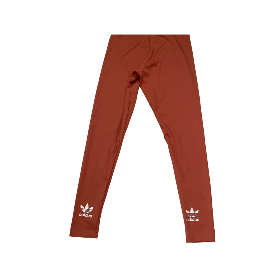 Orange Adidas leggings on a white background