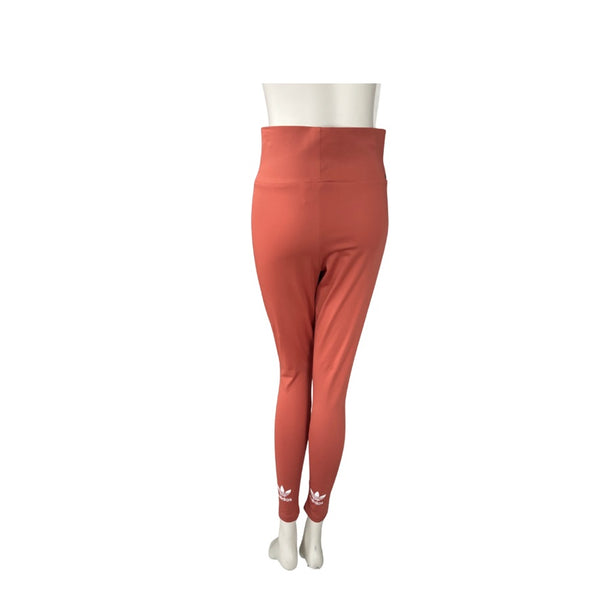 Orange leggings with Adidas logo on a white background