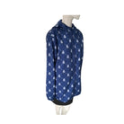 Blue raincoat with white patterns on a mannequin against a white background