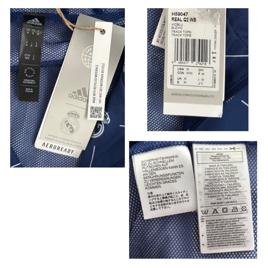 Close-up of Adidas clothing tags with brand logo and text on a blue fabric background