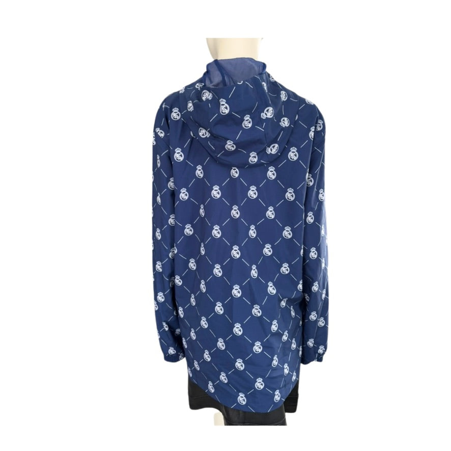 Blue jacket with white patterns on a mannequin against a white background