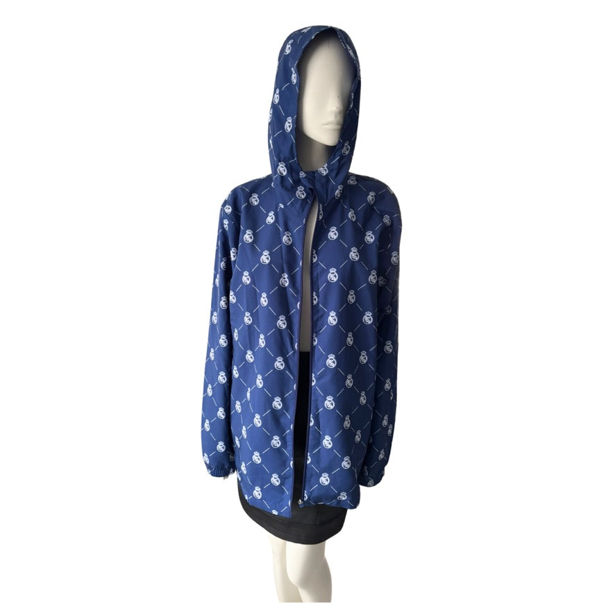 Blue hooded jacket with white patterns on a mannequin against a white background