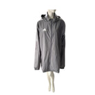 Grey jacket with Adidas logo on a mannequin against a white background