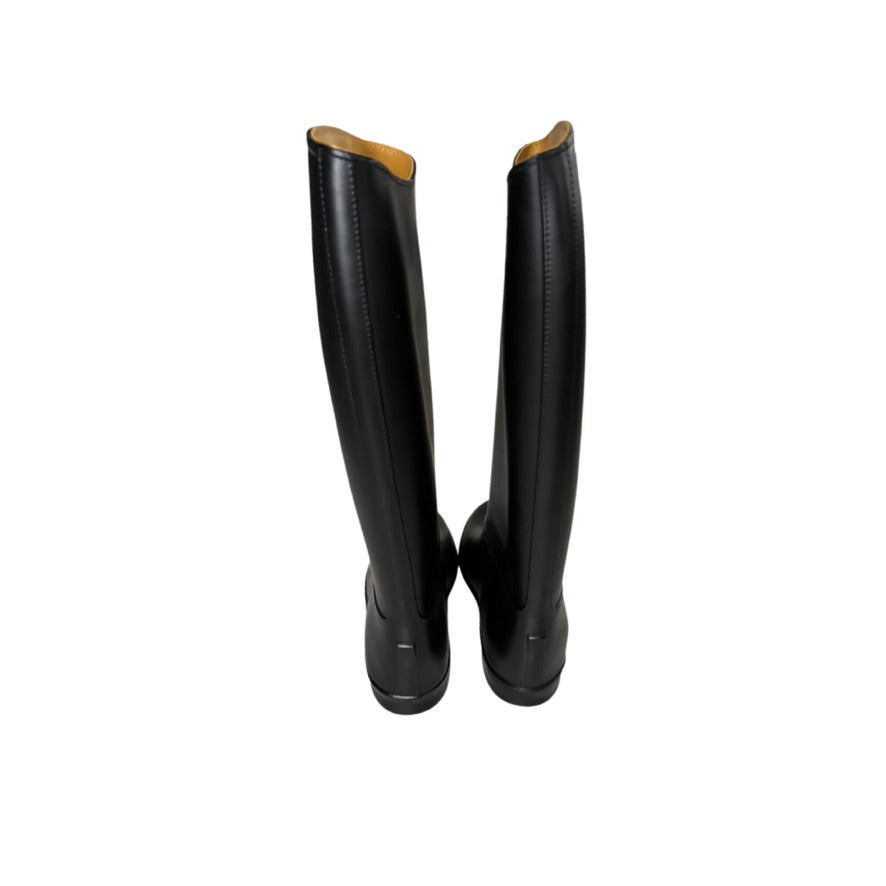 Pair of black knee-high boots on a white background