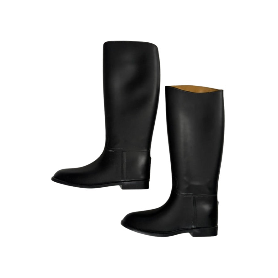 Pair of black riding boots on a white background