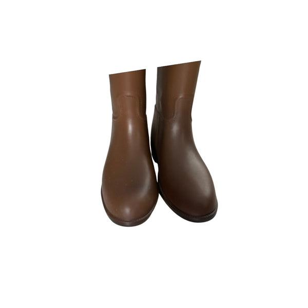 Pair of brown rubber boots on a white background