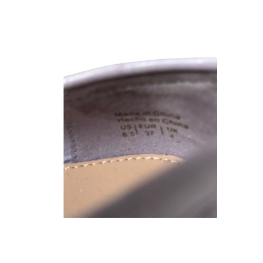 Close-up of a shoe sole with text indicating size and location details.