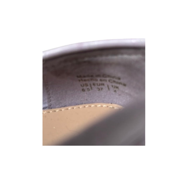 Close-up of a shoe sole with text indicating size and location details.