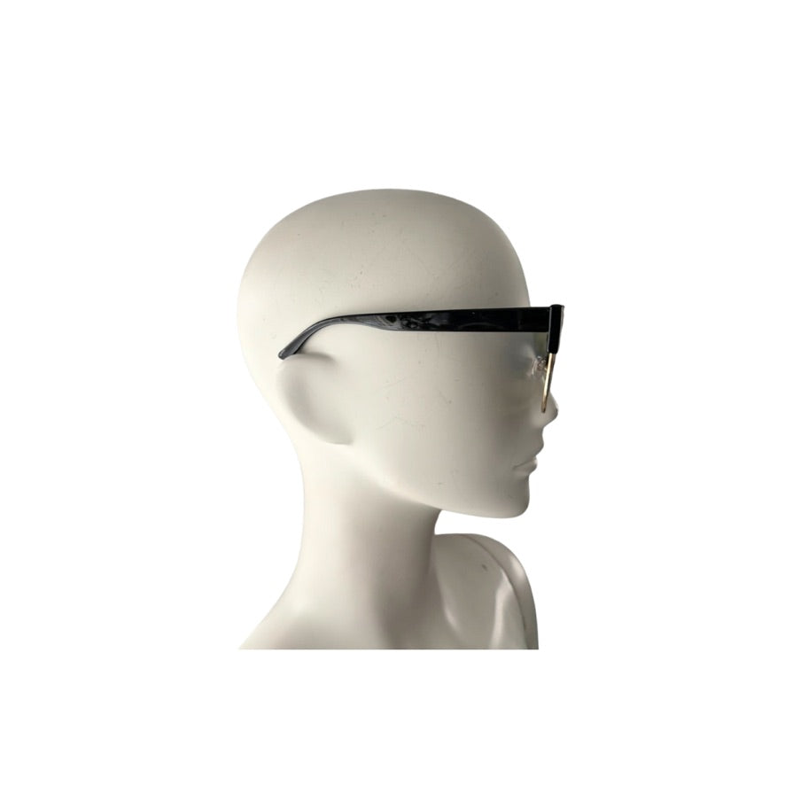 Mannequin head wearing a pair of sunglasses on a white background
