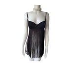 Black fringe dress on a mannequin against a white background