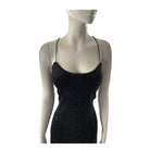 Black textured dress on a mannequin against a white background