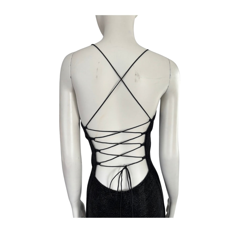 Black strappy top on a mannequin against a white background