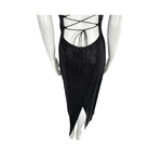 Black dress with criss-cross back design on a mannequin against a white background