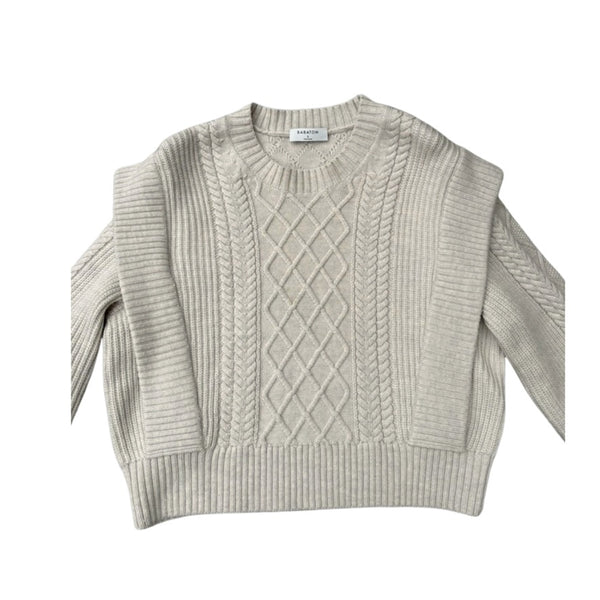 Beige cable knit sweater on a white background