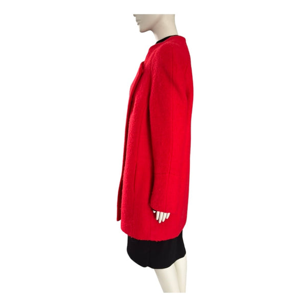 Red coat on a mannequin against a white background