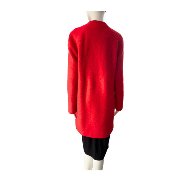 Red coat on a mannequin against a white background