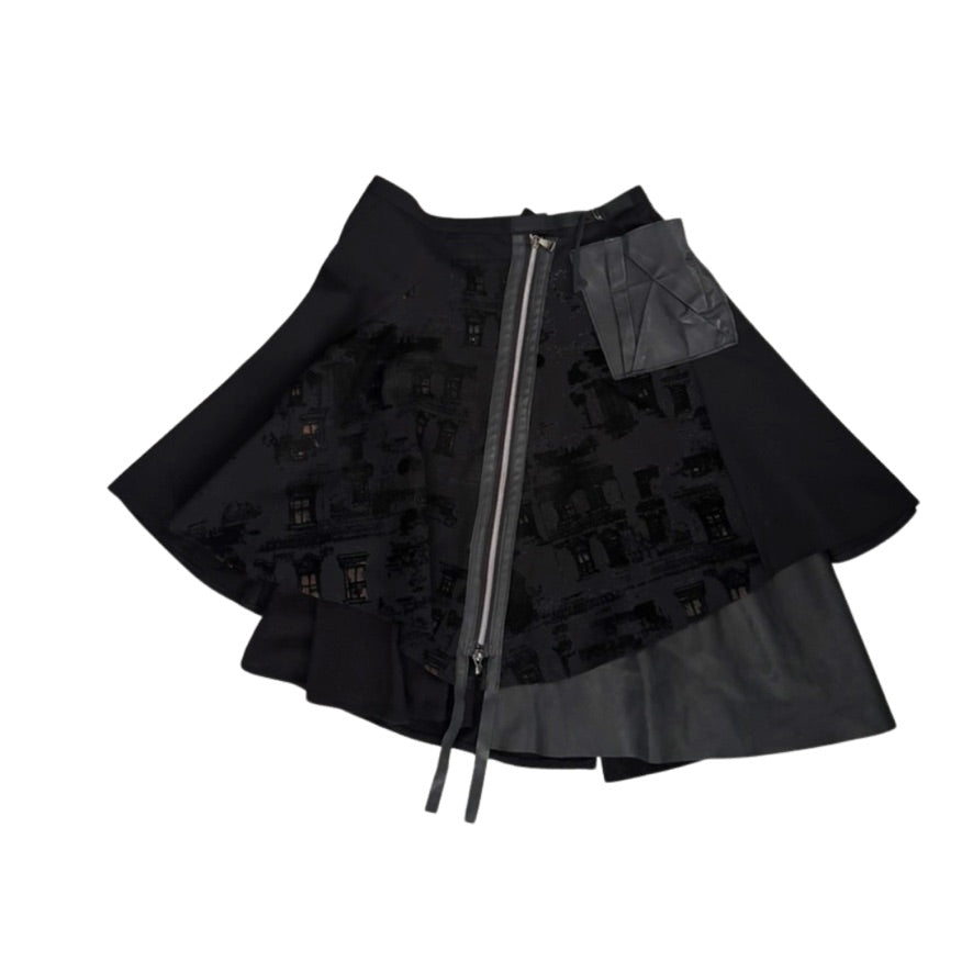 Black layered skirt with zipper on a white background