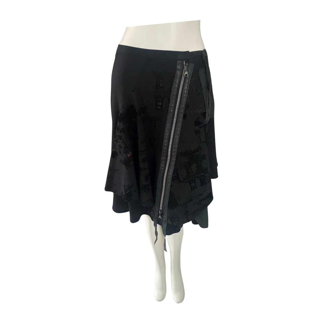 Black skirt with zipper on a mannequin against a white background
