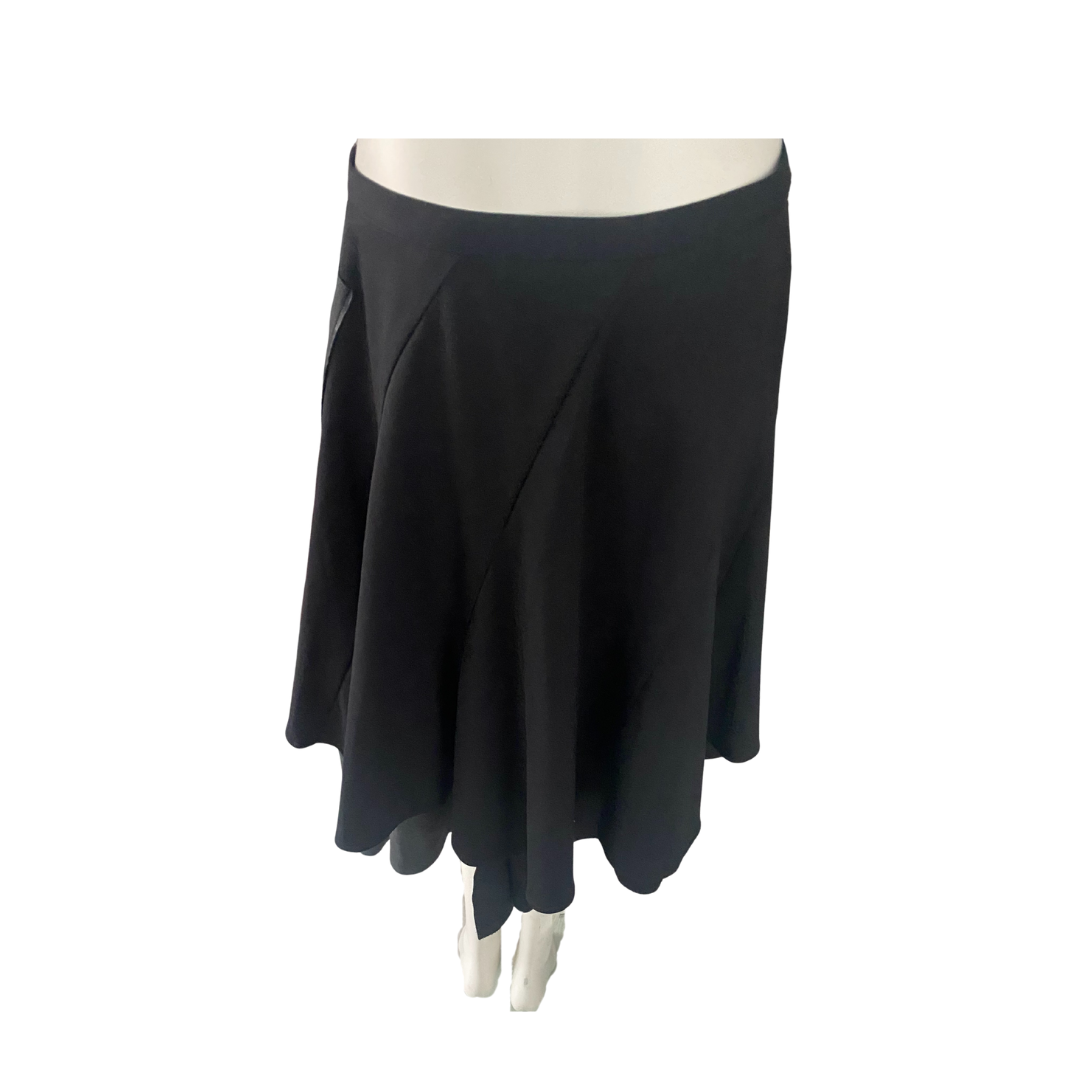 Black skirt on a mannequin against a white background