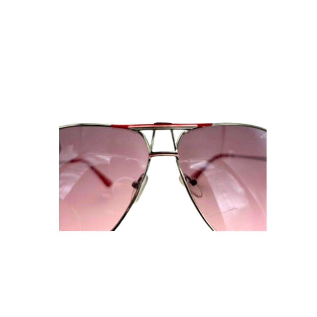 Sunglasses with pink lenses and silver frame on a white background