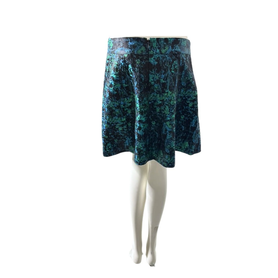 Blue patterned skirt on a white mannequin against a white background