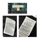 Close-up of a label on a garment with text and symbols.