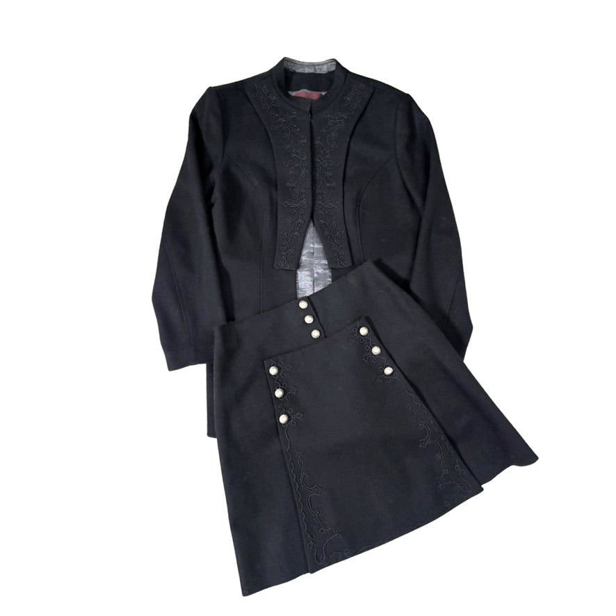 Black coat with a skirt and buttons on a white background