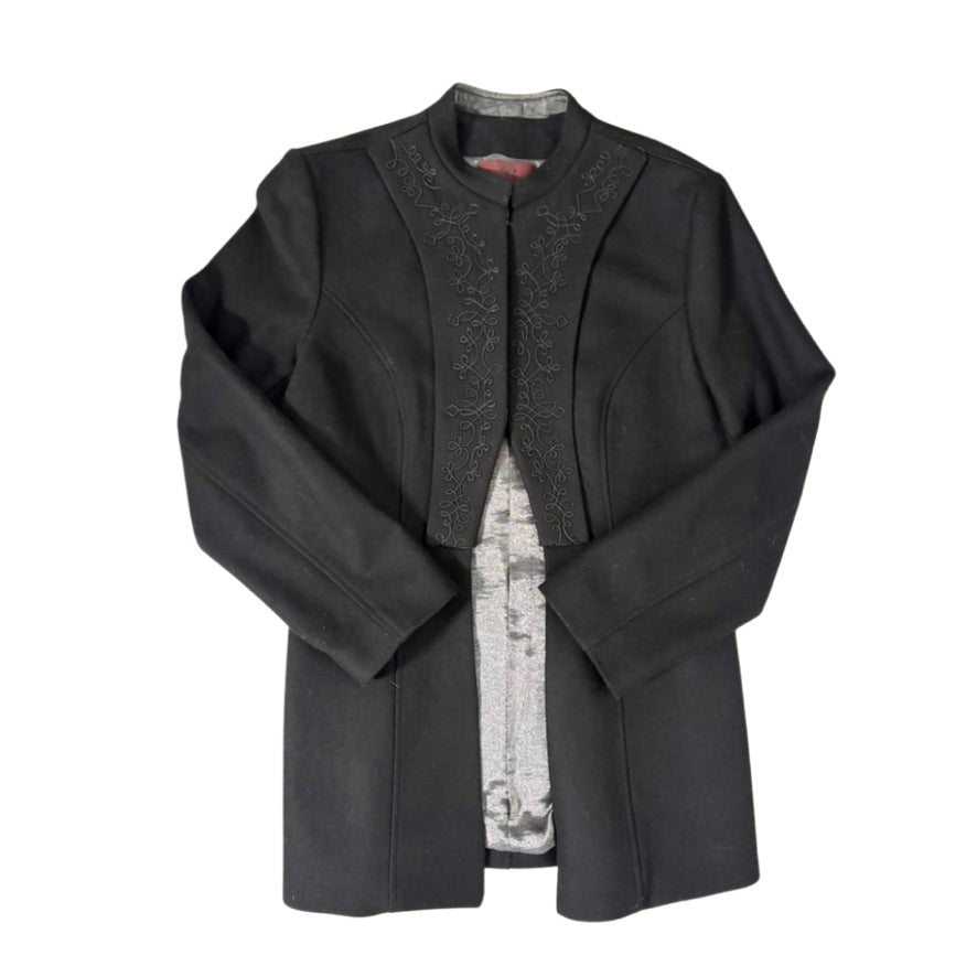 Black coat with intricate detailing on a white background