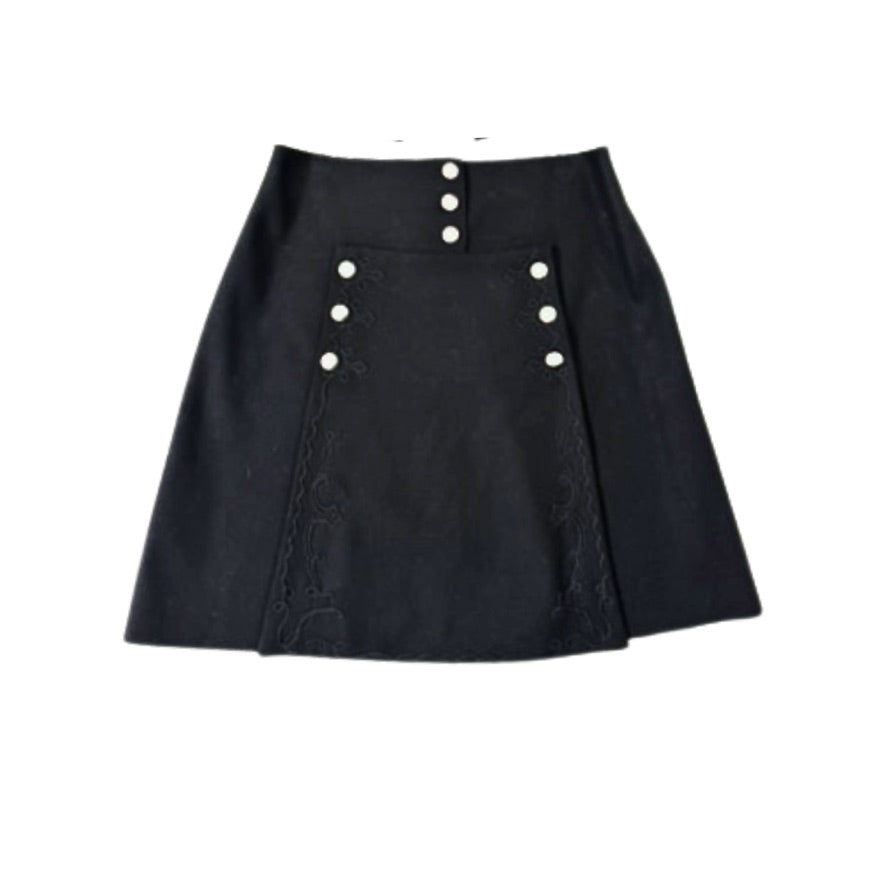Black skirt with button details on a white background