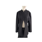 Black coat on a mannequin against a white background