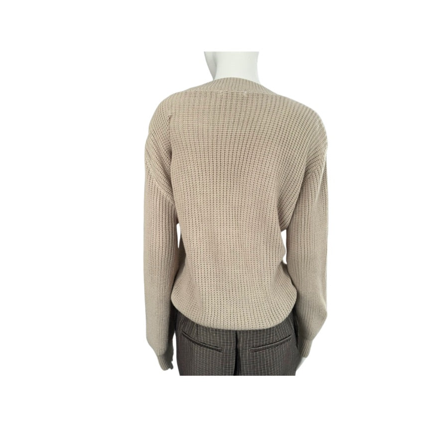 Mannequin wearing a beige sweater on a white background