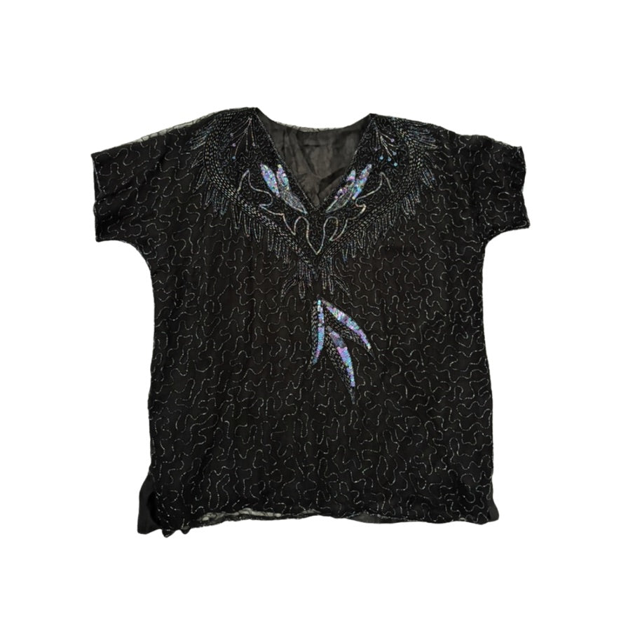 Black t-shirt with decorative patterns on a white background