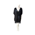 Black sequin top on a mannequin against a white background