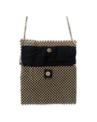 Black handbag with gold beaded detailing on a white background