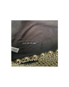 Primark label on black fabric a white background