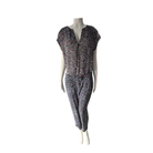 Mannequin wearing a patterned jumpsuit on a white background