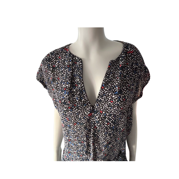 patterned top on a mannequin against a white background