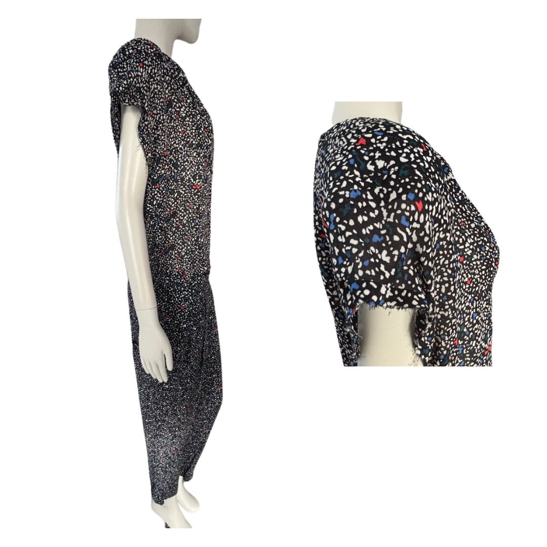 Black and white patterned dress on a mannequin with a plain background