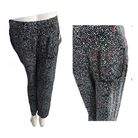 Black pants with multicolor speckle pattern on a white background